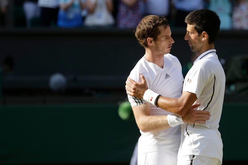 FILE - Andy Murray of Britain, left, is congratulated by Novak Djokovic of Serbia after he won the Men's singles final match at the All England Lawn Tennis Championships in Wimbledon, London, Sunday, July 7, 2013. Murray will play only doubles at his last appearance at the All England Club following his withdrawal from singles after back surgery. (AP Photo/Anja Niedringhaus, Pool, File)