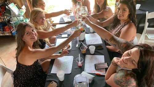 Friends enjoy the wine and ambiance at The Cottage Vineyard and Winery in Cleveland.
(Courtesy of The Cottage Vineyard and Winery)