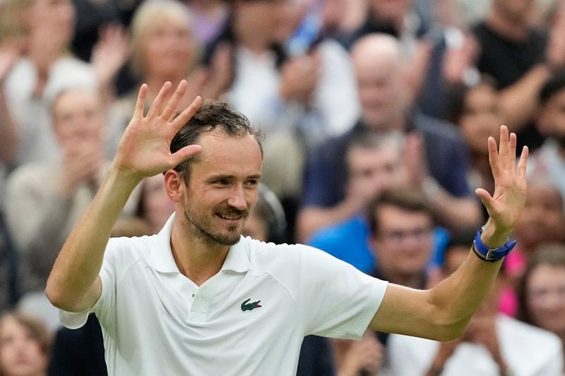 Daniil Medvedev of Russia celebrates after defeating Jannik Sinner of Italy in their quarterfinal match at the Wimbledon tennis championships in London, Tuesday, July 9, 2024. (AP Photo/Mosa'ab Elshamy)