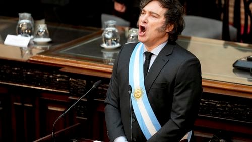 Argentina's President Javier Milei sings the national anthem as he addresses Congress to present the 2025 budget in Buenos Aires, Argentina, Sunday, Sept. 15, 2024. (AP Photo/Natacha Pisarenko)