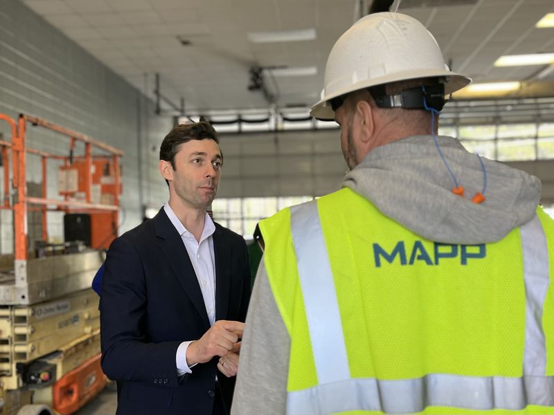 U.S. Sen. Jon Ossoff (left) talks to Bryan Pickens, the senior project manager with MAPP Construction to renovate the old fire station into a new workforce development center on Thursday, Feb. 15, 2024, in Mableton. (Taylor Croft/taylor.croft@ajc.com)
