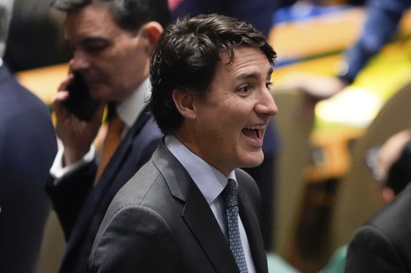 Canada's Prime Minister Justin Trudeau greets people during the 79th session of the United Nations General Assembly, Tuesday, Sept. 24, 2024, at the UN headquarters. (AP Photo/Julia Demaree Nikhinson)