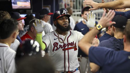 Atlanta Braves designated hitter Marcell Ozuna celebrates his solo home run with teammates in the dugout during the fifth inning against the New York Mets at Truist Park, Tuesday, Sept. 24, 2024, in Atlanta. The Braves won 5-1. (Jason Getz / AJC)