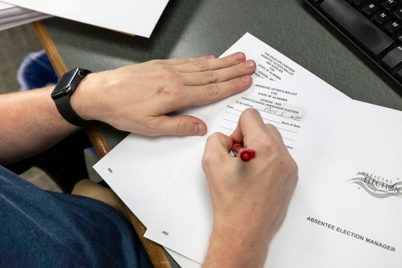 Trey Forrest, Absentee Election Coordinator for the Jefferson County/Birmingham (Ala) Division, prepares absentee ballots for the November election, Tuesday, Sept. 10, 2024, in Birmingham, Ala. (AP Photo/Vasha Hunt)