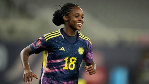 FILE - Colombia's Linda Caicedo celebrates after scoring a goal against Panama during the second half of a CONCACAF Gold Cup women's soccer tournament match, Wednesday, Feb. 21, 2024, in San Diego. The 19-year-old Colombian, one of soccer’s brightest young stars, is readying to play at the Olympics in France and maybe — although it's a stretch — the under-20 Women’s World Cup hosted by her home country starting in late August. (AP Photo/Gregory Bull, File)