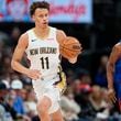 New Orleans Pelicans guard Dyson Daniels, left, pulls in a loose ball as Denver Nuggets forward Peyton Watson pursues in the second half of an NBA basketball game Friday, Jan. 12, 2024, in Denver. (AP Photo/David Zalubowski)