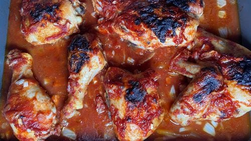 Oven-baked barbecued chicken was a favorite that the late John Lewis made in a large pan at Christmastime. Bob Townsend for The Atlanta Journal-Constitution.