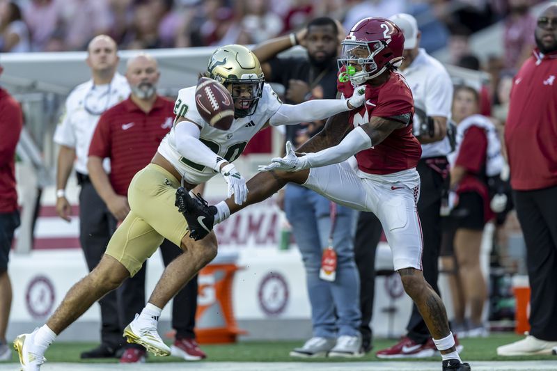 Alabama wide receiver Ryan Williams (2) draws a pass interference penalty by South Florida defensive back Brent Austin (20) during the first half of an NCAA college football game, Saturday, Sept. 7, 2024, in Tuscaloosa, Ala. (AP Photo/Vasha Hunt)