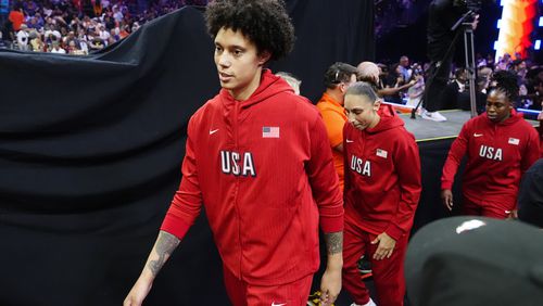 Brittney Griner, left, Diana Taurasi, and Chelsea Gray, of Team USA, walk on the court prior to a WNBA All-Star basketball game against Team WNBA, Saturday, July 20, 2024, in Phoenix. (AP Photo/Ross D. Franklin)