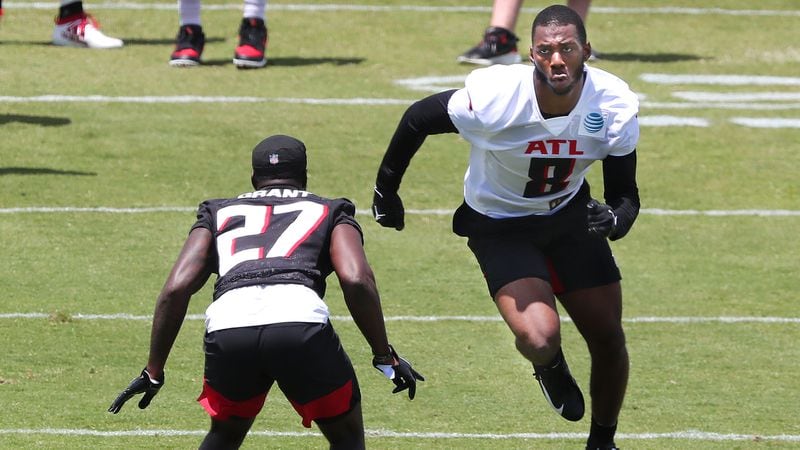 Falcons rookie tight end Kyle Pitts (8) squares off against Richie Grant during the first day of rookie minicamp Friday, May 14, 2021, in Flowery Branch. (Curtis Compton/Curtis.Compton@ajc.com)