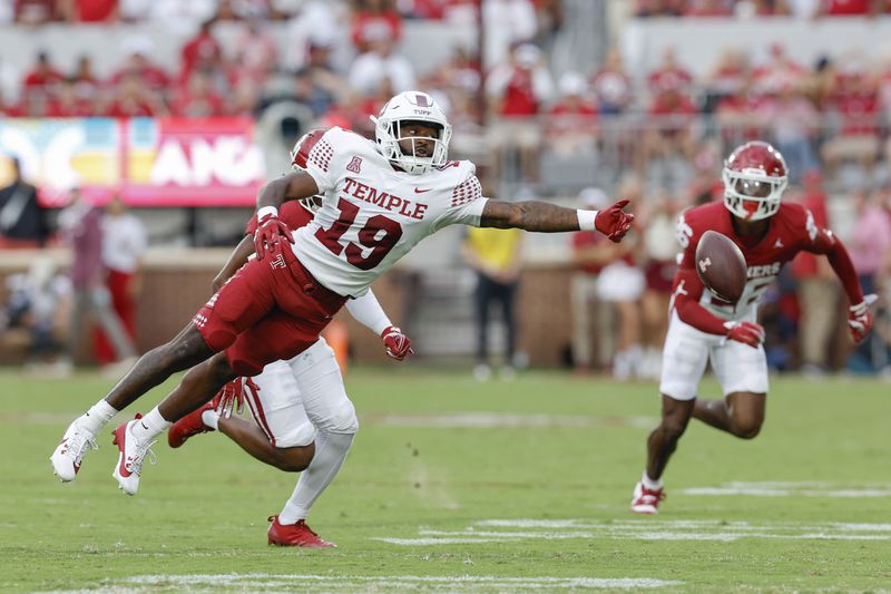 Temple wide receiver Antonio Jones (19) misses a pass during the first quarter of an NCAA college football game against Oklahoma, Friday, Aug. 30, 2024, in Norman, Okla. (AP Photo/Alonzo Adams)