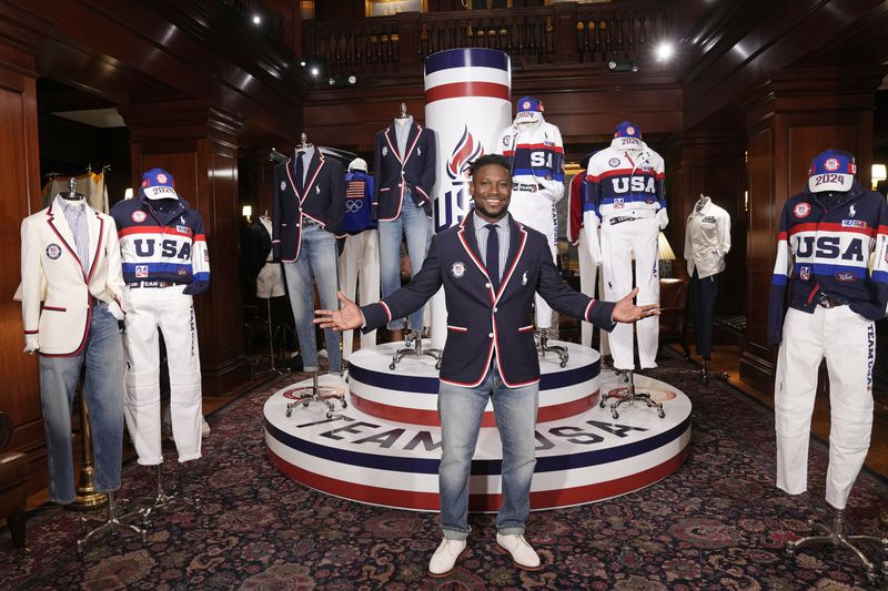 Olympic athlete in fencing, Daryl Homer, models the Team USA Paris Olympics opening ceremony uniform at Ralph Lauren headquarters on Monday, June 17, 2024, in New York. (Photo by Charles Sykes/Invision/AP)
