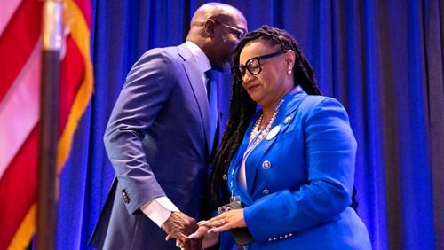 U.S. Sen. Raphael Warnock, D-Ga., greets U.S. Rep. Nikema Williams, D-Atlanta, before taking the stage at the Georgia delegation breakfast at the Hyatt Regency in Chicago on Monday, August 19, 2024, the first day of the Democratic National Convention. (Arvin Temkar / AJC)