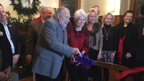 Smyrna Mayor Max Bacon cut the ribbon at the Dec. 11 opening of the city’s Reed House, 3080 Atlanta Road, for use as a special event facility. Courtesy of Smyrna
