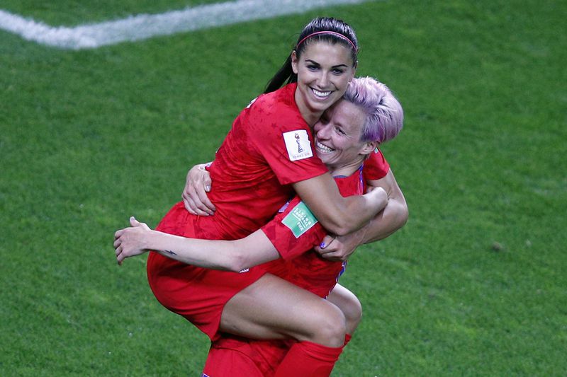 FILE - United States' Megan Rapinoe, right, congratulates teammate Alex Morgan after scoring her fifth goal during the Women's World Cup Group F soccer match between the United States and Thailand at the Stade Auguste-Delaune in Reims, France, Tuesday, June 11, 2019. (AP Photo/Francois Mori, File)