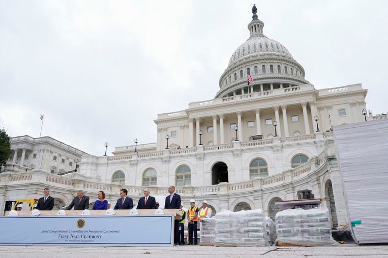 Congress members hammer in the first nails at the First Nail Ceremony marking the beginning of construction of the 2025 Presidential Inauguration platform on the steps of the Capitol, Wednesday, Sept. 18, 2024, in Washington. (AP Photo/Mariam Zuhaib)