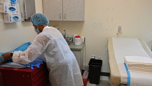 On June 29, 2022, a clinic staffer prepares for a patient at an examination room at Feminist Women's Health Center in Atlanta. (Hyosub Shin/The Atlanta Journal-Constitution/TNS)