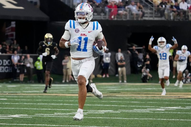 Mississippi wide receiver Jordan Watkins (11) runs for a touchdown after a catch against Wake Forest during the first half of an NCAA college football game in Winston-Salem, N.C., Saturday, Sept. 14, 2024. (AP Photo/Chuck Burton)