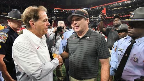 Alabama's head coach Nick Saban and Georgia's head coach Kirby Smart shake hands after Alabama beat Georgia during the Southeastern Conference championship at Mercedes-Benz Stadium in Atlanta on Dec. 4, 2021. (Hyosub Shin/The Atlanta Journal-Constitution/TNS)