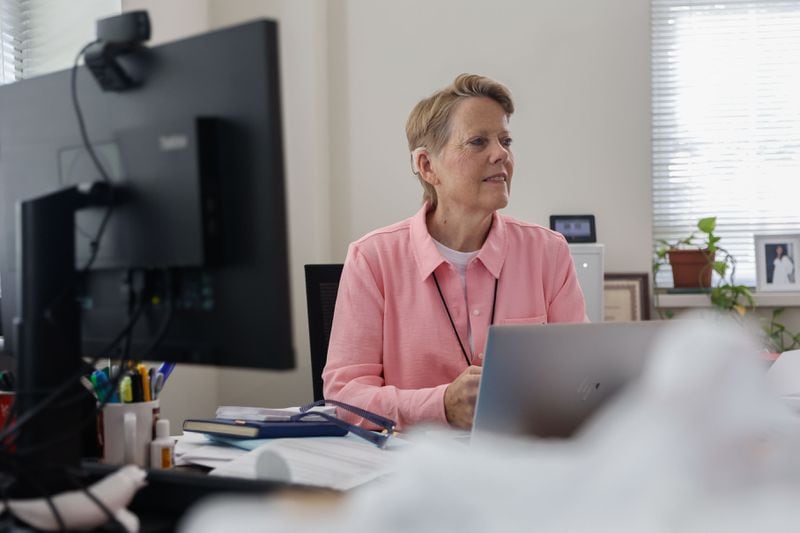 Midtown High School Principal Betsy Bockman poses for a photo in her office on Monday, July 22, 2024. Midtown High School recently implemented a no-cellphone policy for students that will start this fall. (Natrice Miller/ AJC)