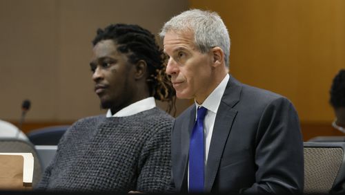Young Thug, whose real name is Jeffery Lamar Williams, and his lawyer, Brian Steel, watch Judge Ural Glanville speak during the hearing of key witness Kenneth Copeland at the Fulton County Superior Court in Atlanta on June 10, 2024. The judge overseeing the racketeering and gang prosecution against Young Thug and others on Monday, July 1, 2024 put the long-running trial on hold until another judge rules on requests by several defendants that he step aside from the case. (Miguel Martinez/Atlanta Journal-Constitution via AP, file)