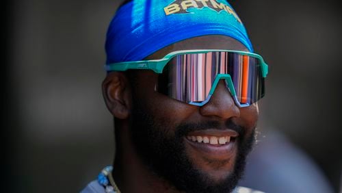 Braves' Michael Harris II smiles in the dugout during the third inning of a baseball game against the Chicago Cubs, Thursday, May 23, 2024, in Chicago. (AP Photo/Erin Hooley)