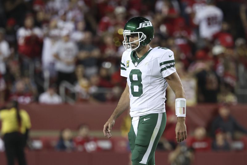 New York Jets quarterback Aaron Rodgers walks on the field during the second half of an NFL football game against the San Francisco 49ers in Santa Clara, Calif., Monday, Sept. 9, 2024. (AP Photo/Jed Jacobsohn)