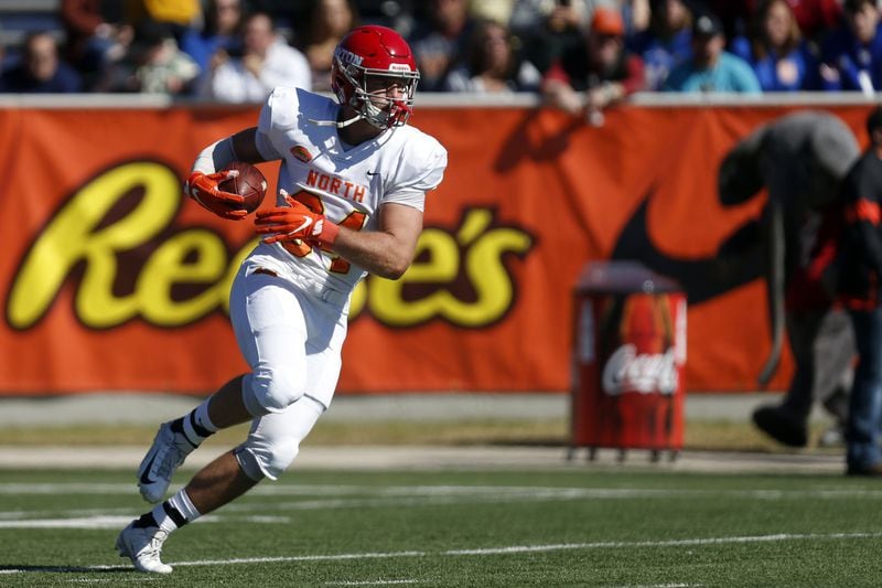 North tight end Adam Trautman of Dayton (84) warms up before the start of the Senior Bowl college football game Saturday, Jan. 25, 2020, in Mobile, Ala. (AP Photo/Butch Dill)