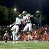 August 20, 2021 - Kennesaw, Ga: Buford wide receiver Tobi Olawale (4) celebrates his receiving touchdown with running back Victor Venn (6) during the second half against North Cobb at North Cobb high school Friday, August 20, 2021 in Kennesaw, Ga.. Buford won 35-27. JASON GETZ FOR THE ATLANTA JOURNAL-CONSTITUTION



