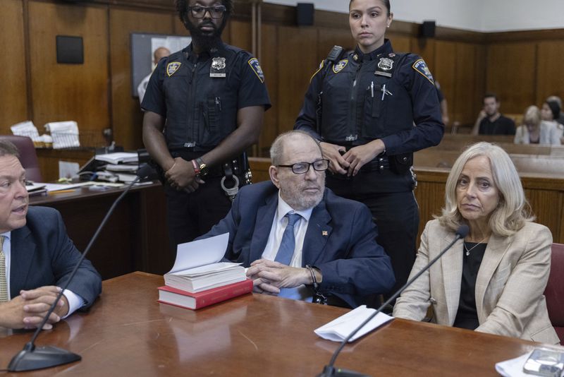 Harvey Weinstein, center, appears in criminal court in New York, Wednesday, Sept. 18, 2024. (Jeenah Moon/Pool Photo via AP)