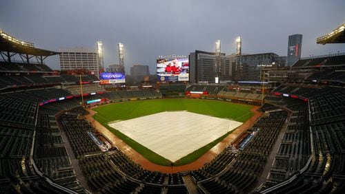 Truist Park absorbs heavy rain because of Hurricane Helene   Wednesday. The Braves vs. Mets game was postponed, as was Thursday's game. The teams will play a doubleheader Monday instead. 
(Miguel Martinez/ AJC)