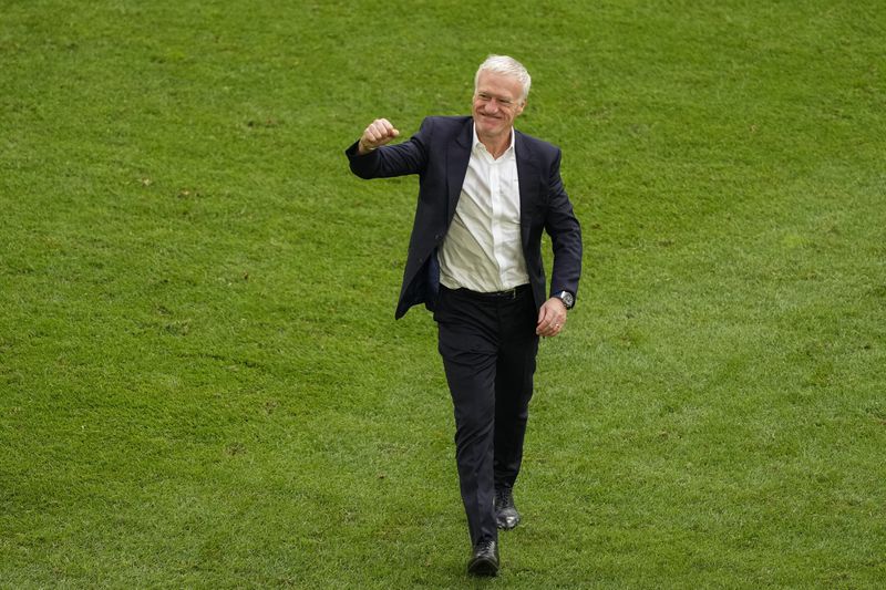 France head coach Didier Deschamps celebrates at the end of a round of sixteen match between France and Belgium at the Euro 2024 soccer tournament in Duesseldorf, Germany, Monday, July 1, 2024. (AP Photo/Andreea Alexandru)