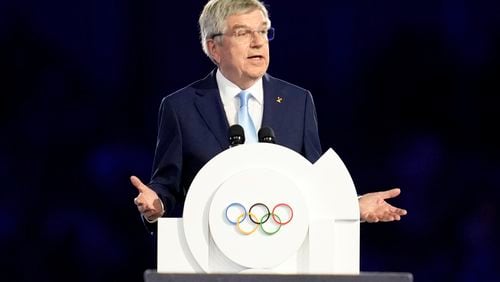 FILE - IOC President Thomas Bach addresses the audience during the 2024 Summer Olympics closing ceremony at the Stade de France, Aug. 11, 2024, in Saint-Denis, France. (AP Photo/Ashley Landis, File)