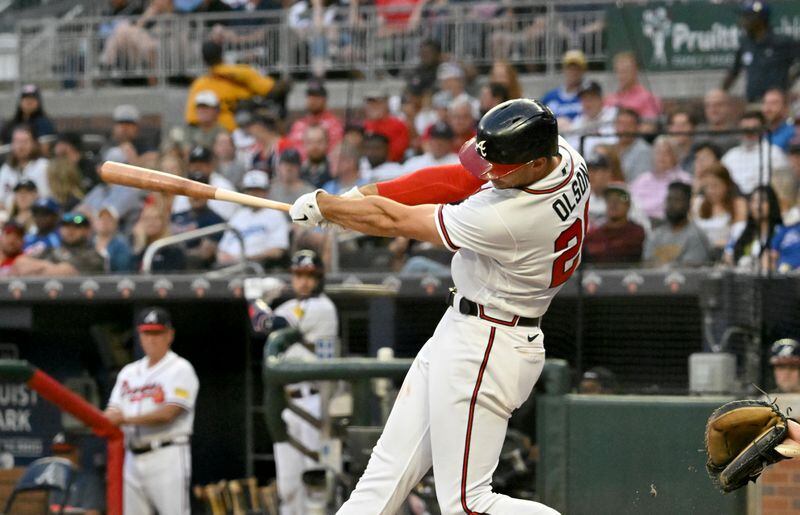 Atlanta Braves' first baseman Matt Olson (28) hits a solo home run during the fourth inning at Truist Park, Wednesday, May 24, 2023, in Atlanta. The Atlanta Braves won 4-3 over the Los Angeles Dodgers. (Hyosub Shin / Hyosub.Shin@ajc.com)