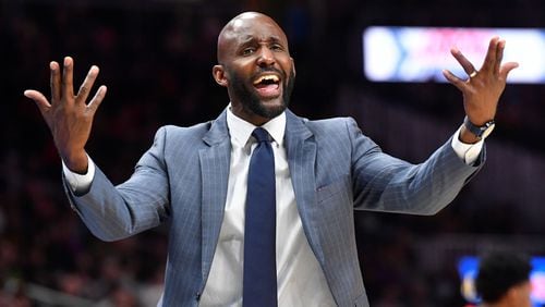 Atlanta Hawks coach Lloyd Pierce wants a foul called as he reacts toward an official during the second half of an NBA basketball game against the Milwaukee Bucks, Friday, Dec. 27, 2019, in Atlanta. (AP Photo/John Amis)