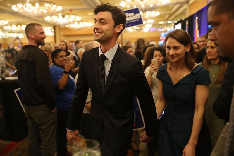 Jon Ossoff walks with his then-girlfriend-and-now-wife Alisha Kramer after speaking to supporters during his unsuccessful bid in a 2017 special election for the U.S. House. Democrats from across the nation ralled behind Ossoff in that race, helping him raise tens of millions of dollars. (Photo by Joe Raedle/Getty Images)