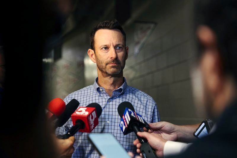 St. Louis Cardinals Chairman and Chief Executive Officer Bill DeWitt Jr. reads a statement at the beginning of a press conference Monday, Sept. 30, 2024, at Busch Stadium in St. Louis. (Zachary Linhares/St. Louis Post-Dispatch via AP)