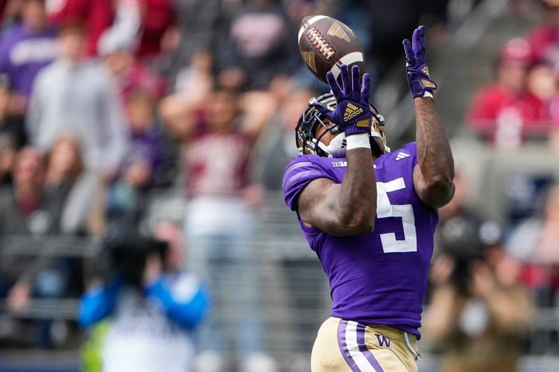 Washington wide receiver Giles Jackson (5) makes a touchdown catch against Washington State during the first half of an NCAA college football game Saturday, Sept. 14, 2024, in Seattle. (AP Photo/Lindsey Wasson)