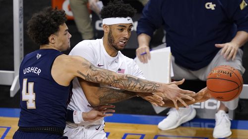 Georgia Tech guard Jordan Usher (4) guards Florida State guard Anthony Polite (2) during the first half of Saturday's ACC championship game in Greensboro, N.C.