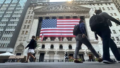 FILE - The American flag hangs from the front of the New York Stock Exchange on Sept. 10, 2024, in New York. (AP Photo/Peter Morgan, File)