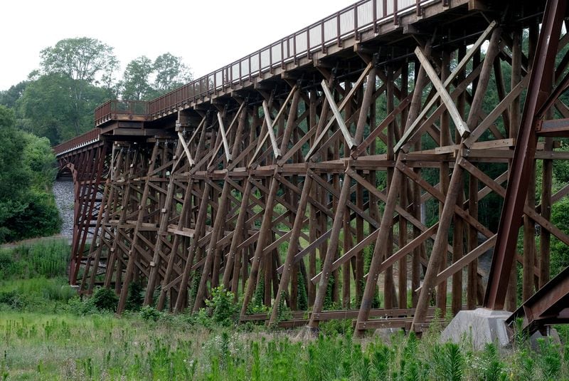 The railroad trestle, featured on the back of the R.E.M. Murmur album, was saved from demolition and is now part of the the Firefly Trail, a paved exercise trail that used to be former railway lines in Athens, Ga. 