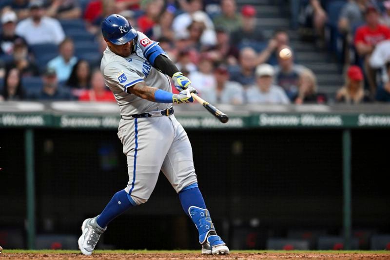 Kansas City Royals' Salvador Perez hits a solo home run during the fifth inning of the second game of a baseball doubleheader against the Cleveland Guardians, Monday, August 26, 2024, in Cleveland. (AP Photo/Nick Cammett)