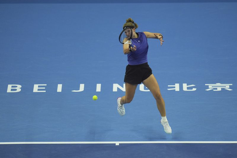 Karolina Muchova of Czech Republic returns a shot to Coco Gauff of the United States during the women's singles final match at the China Open tennis tournament at the National Tennis Center in Beijing, Sunday, Oct. 6, 2024. (AP Photo/Ng Han Guan)