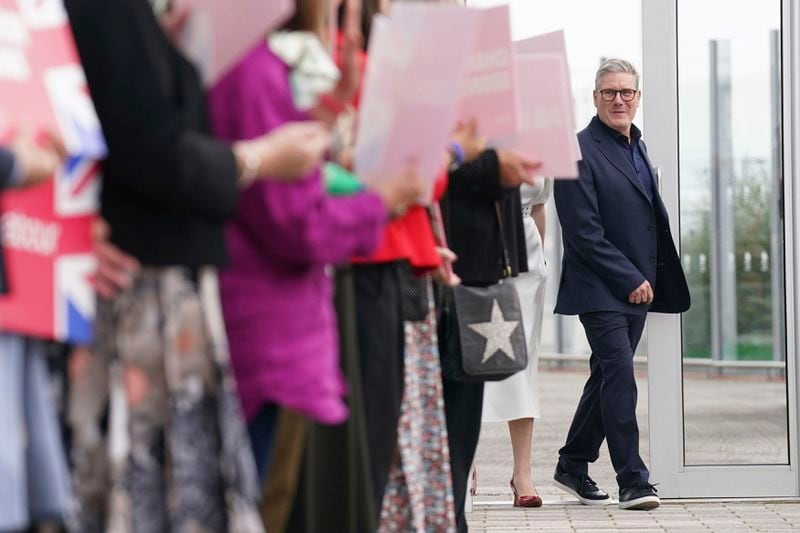 Britain's Prime Minister Keir Starmer and Deputy Prime Minister Angela Rayner, arrive ahead of the Labour Party Conference, in Liverpool, England, Saturday, Sept. 21, 2024. (Stefan Rousseau/PA via AP)