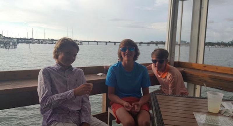 Elijah DeWitt (left), Max Aldridge (center) and Bowman Horn (right) enjoy a beach trip together on family vacation.