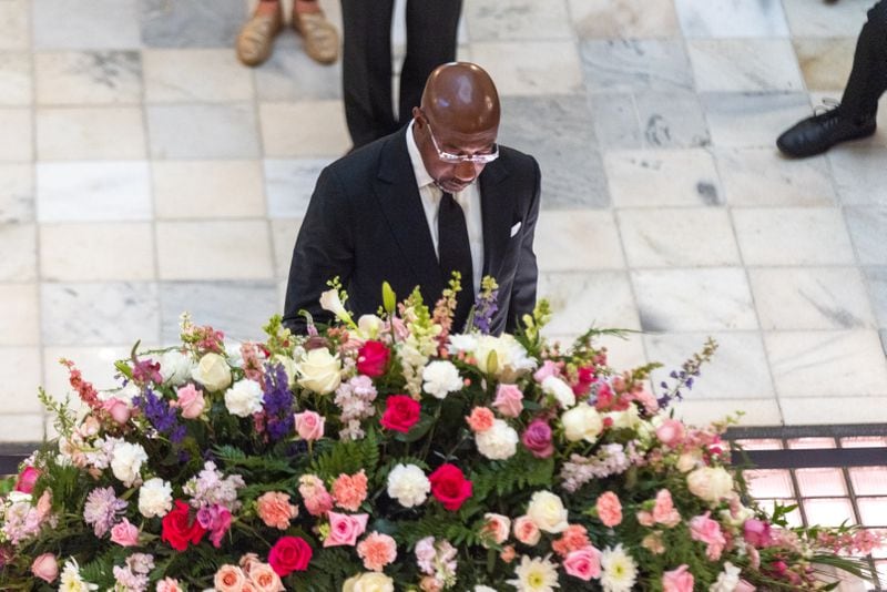U.S. Sen. Raphael Warnock pays respects at a ceremony honoring teacher and civil rights activist Christine King Farris, Martin Luther King Jr.’s sister, in the rotunda of the Capitol in Atlanta on Friday, July 14, 2023. (Arvin Temkar / arvin.temkar@ajc.com)