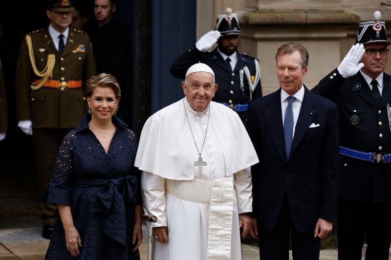 Pope Francis is welcomed by Grand Duchess Maria Teresa, left, and Luxembourg's Grand Duke Henri, right, at the Grand Ducal Palace in Luxembourg, Thursday, Sept. 26, 2024. (AP Photo/Omar Havana)