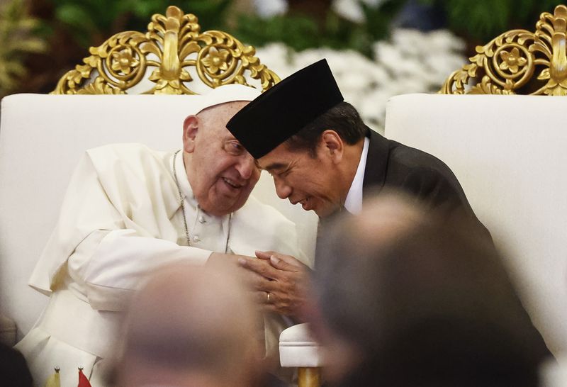 Pope Francis, left, and Indonesian President Joko Widodo attend a meeting with Indonesian authorities, civil society and the diplomatic corps, during his apostolic visit to Asia, at the Presidential Palace in Jakarta Wednesday, Sept. 4, 2024. (Willy Kurniawan/Pool Photo via AP)