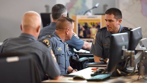 Gwinnett County public safety personnel and other government agencies discuss during their meeting to prepare for the winter weather event that is forecasted for this weekend at Gwinnett County Office of Emergency Management in Lawrenceville on Thursday, January 5, 2017.