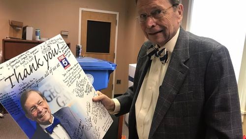 Dick Williams given a thank-you poster from the Fox 5 "Georgia Gang" staff.